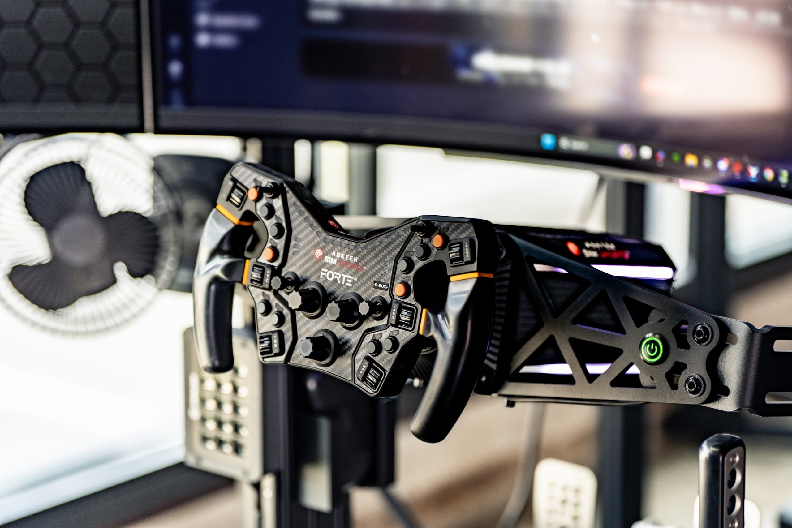 Asetek Forte steering wheel on a custom rig